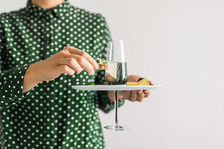 It’s the perfect one-handed plate with a glass holder for the champagne glass